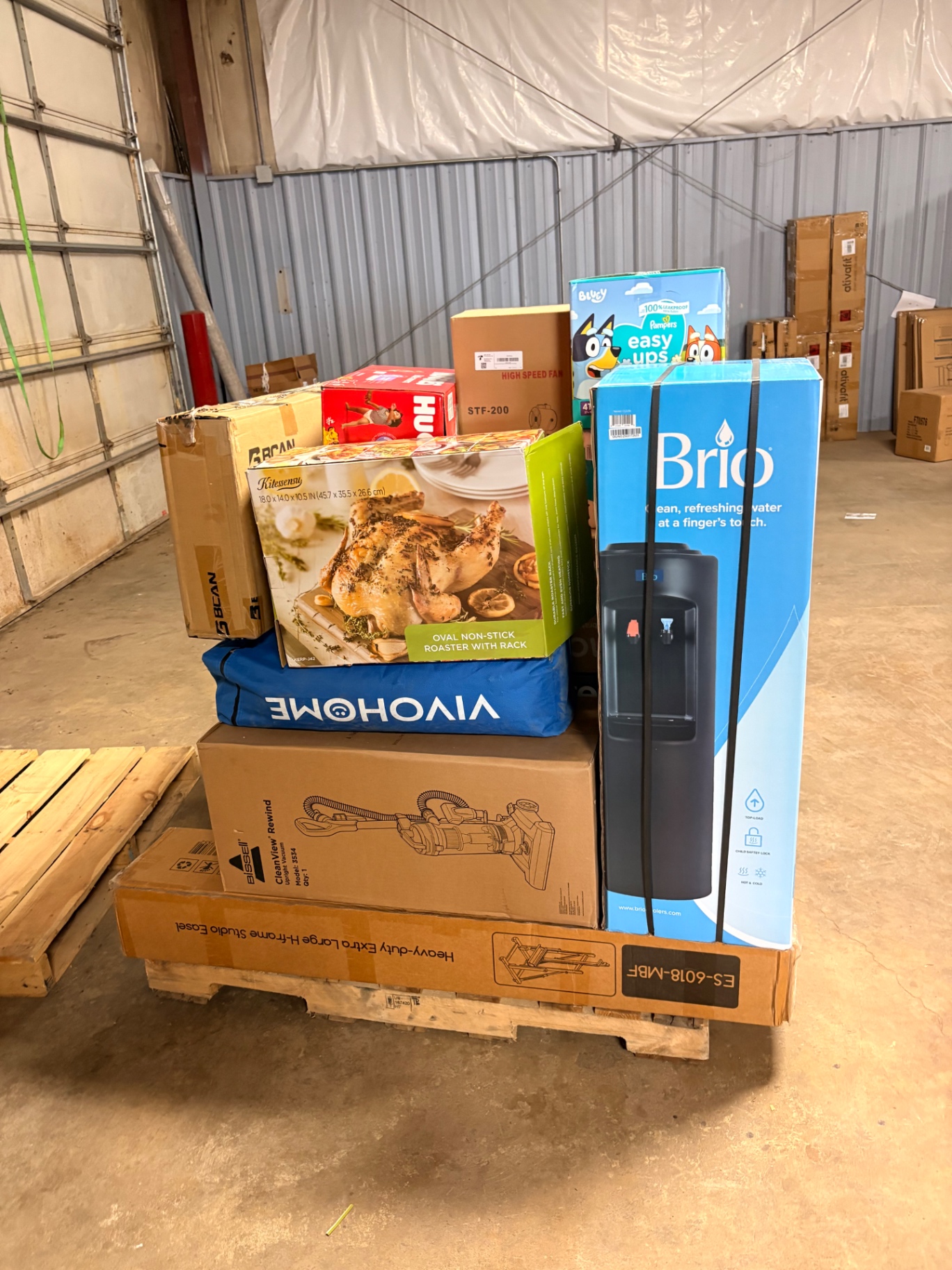 Mixed merchandise pallets and boxed inventory inside the Nest Pointe warehouse