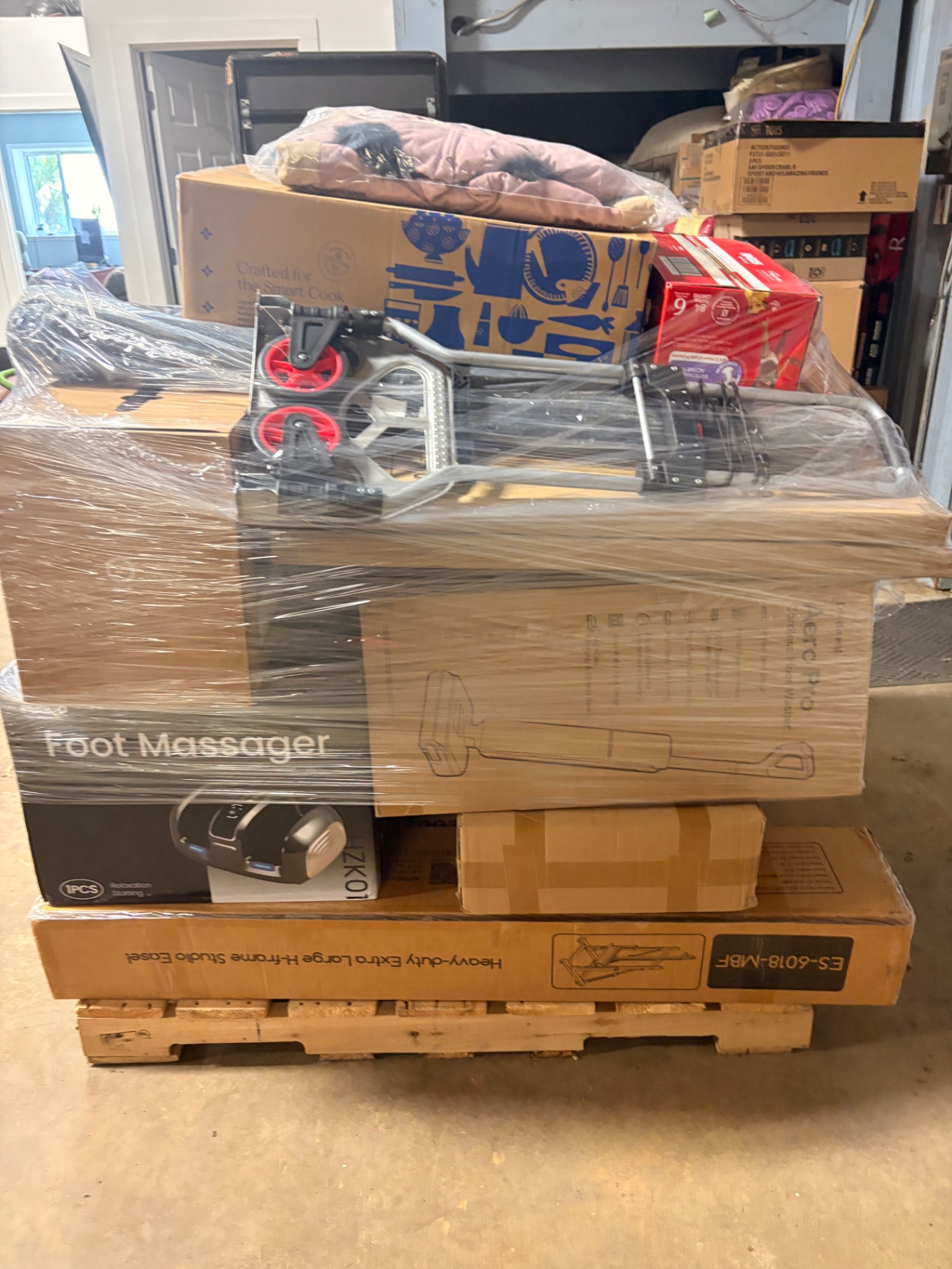 Mixed merchandise pallets and boxed inventory inside the Nest Pointe warehouse